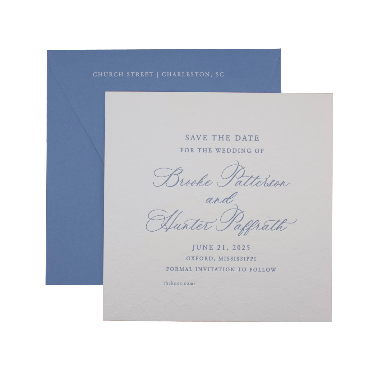 A blue envelope and a white, personalized paper card with elegant blue script and blind deboss detail announce the wedding of Brooke Patterson and Hunter Pappath on June 21, 2025, in Oxford, Mississippi.