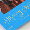 Blue card with 'Merry Christmas' text and a photo inside