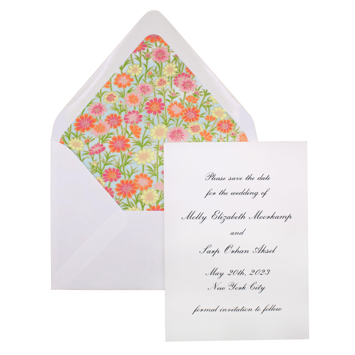 A white engraved card with elegant script rests against a white envelope lined with a floral pattern. This personalized paper details a wedding in New York City on May 20th, 2023—a perfect save the date for your special day.